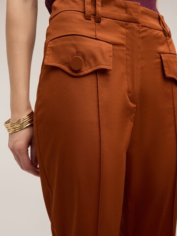 MOTIVI - Acampanado Pantalón en naranja