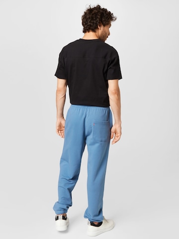 zils LEVI'S ® Pakapēniski sašaurināts piegriezums Bikses 'Levis Sweatpant'