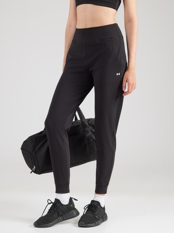 UNDER ARMOUR - Tapered Pantalón deportivo 'Motion' en negro: frente
