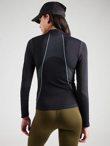 UNDER ARMOUR Toiminnallinen paita 'Vanish' värissä musta