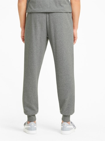 Effilé Pantalon de sport PUMA en gris