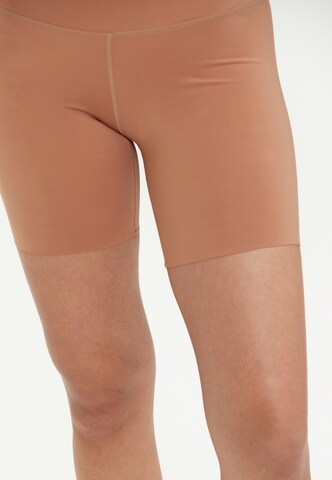 Athlecia Skinny Sportbroek 'Almy' in Oranje