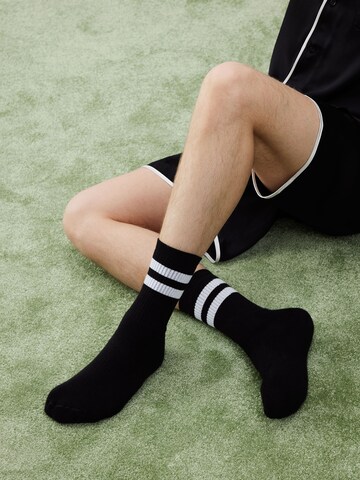 ABOUT YOU x Rewinside Socks 'Timo' in Black