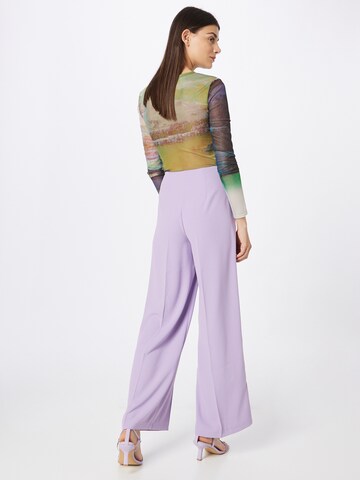 Wide leg Pantaloni con piega frontale di Warehouse in lilla