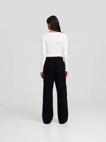 Bershka Loose fit Cargo trousers in Black