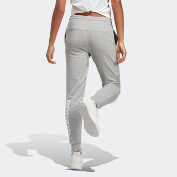 ADIDAS SPORTSWEAR Tapered Urheiluhousut 'Essentials' värissä harmaa