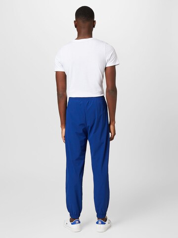 Champion Authentic Athletic Apparel Tapered Broek in Blauw