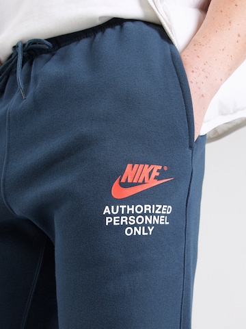 Nike Sportswear Tapered Byxa 'CLUB' i blå