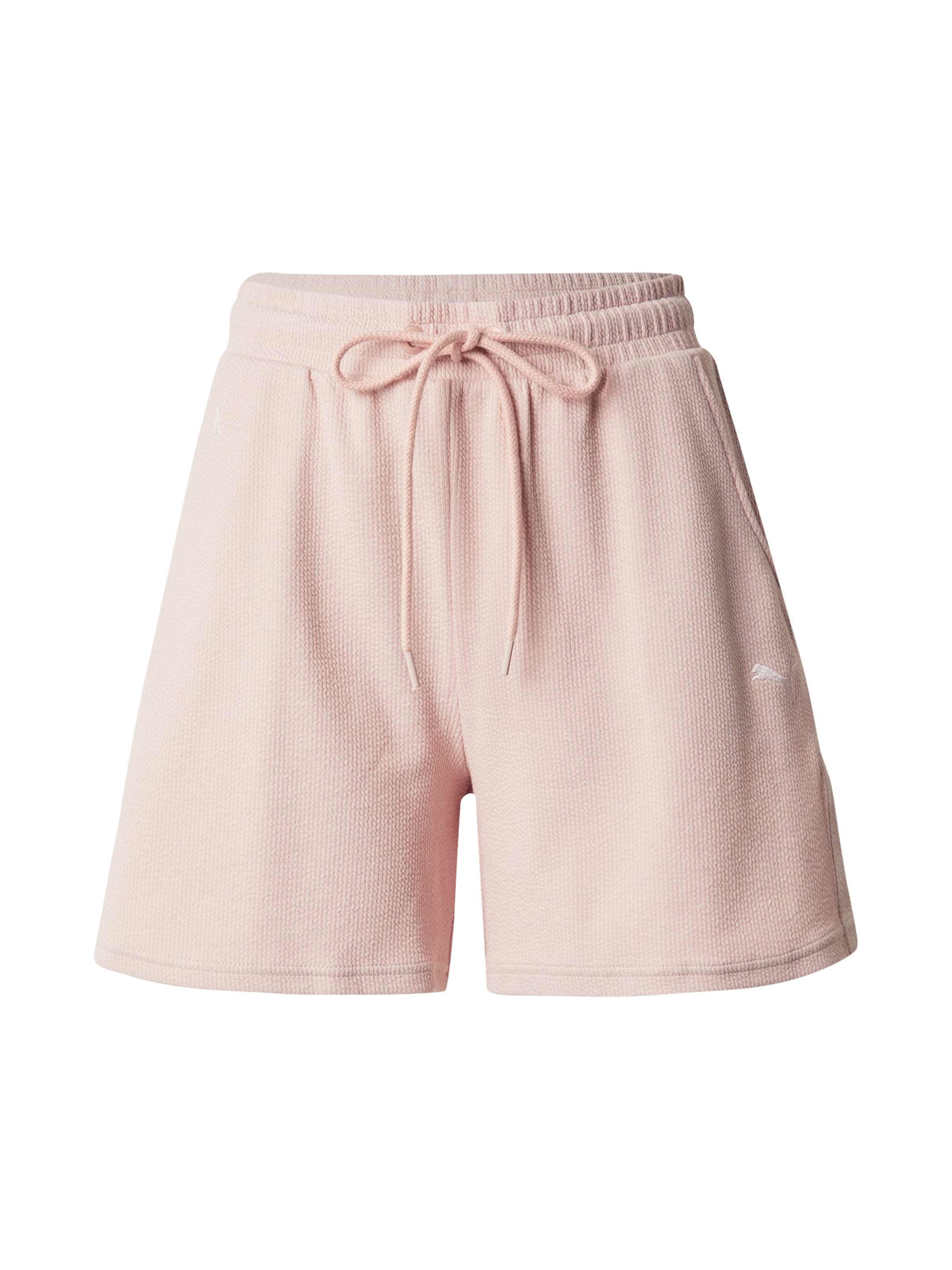 PUMA Lużny krój Spodnie sportowe w kolorze różowy: przód