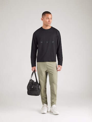 Nike Sportswear Slim fit Trousers in Green
