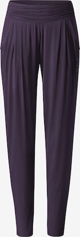 CURARE Yogawear Tapered Pants in Purple: front