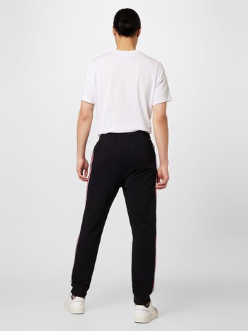 Champion Authentic Athletic Apparel Tapered Hose in Schwarz