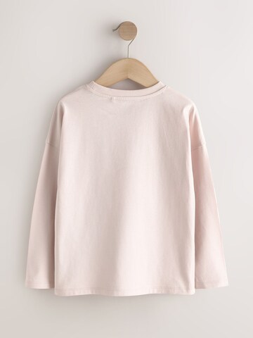Tricou de la Next pe bej