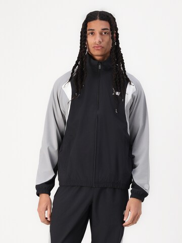 new balance Trainingsjack 'In Game' in Zwart: voorkant