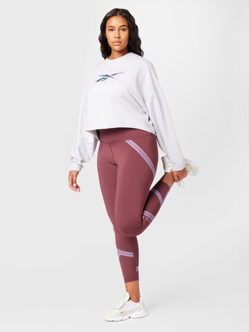 Reebok - Sweatshirt de desporto em cinzento