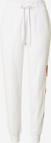 Pantaloni de la Love Moschino pe alb: față