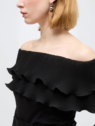 Top ' Flouncecras ' di Crās in nero: lato