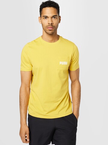 PUMA - Camisa funcionais em amarelo: frente