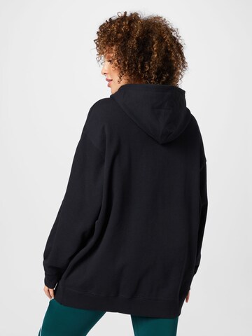 Reebok - Sudadera con cremallera en negro