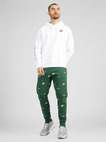 Nike Sportswear Alt kitsenev Püksid 'CLUB', värv roheline