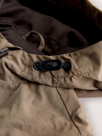 Geacă de primăvară-toamnă de la Next pe maro