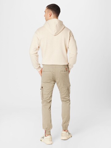 Tapered Pantaloni cargo di ALPHA INDUSTRIES in beige