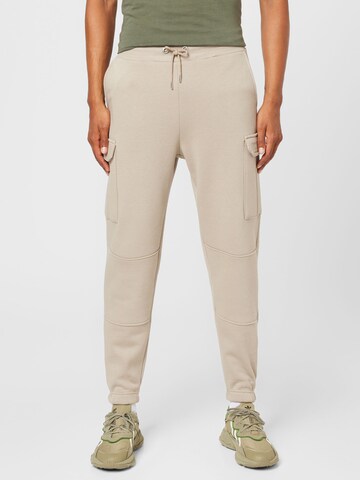 Effilé Pantalon cargo ALPHA INDUSTRIES en beige : devant