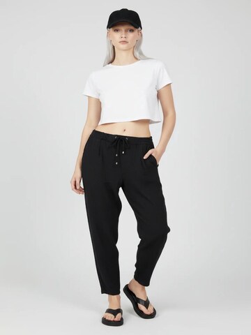No Matter What Tapered Pleat-front trousers in Black