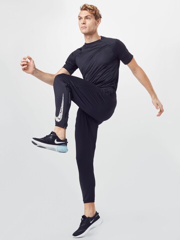 NIKE Tapered Sportbroek 'Wild Run' in Zwart