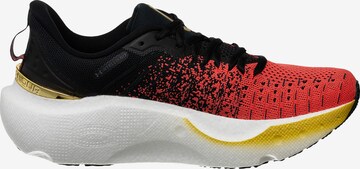 Chaussure de course UNDER ARMOUR en rouge