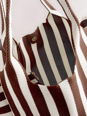 Next Shopper in Bruin