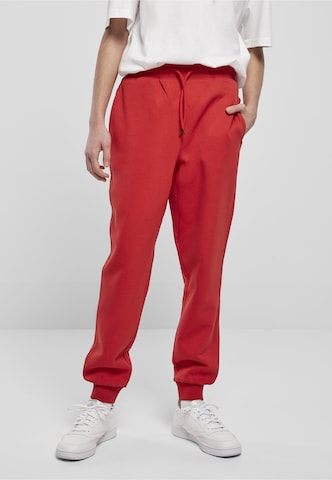 Urban Classics - Tapered Calças em vermelho: frente