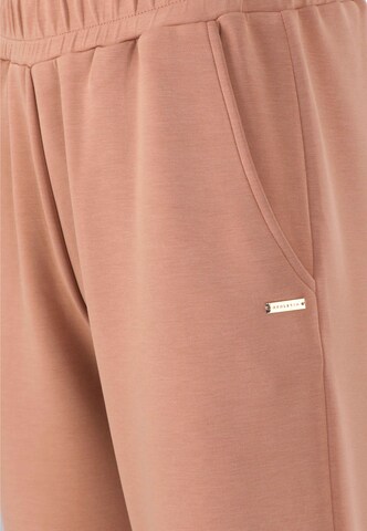 Athlecia Tapered Sportbroek in Beige