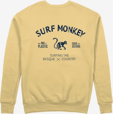 Surf MonkeySweater majica 'Rette das Ozean' - žuta boja: prednji dio