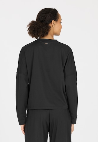 Athlecia Sports sweatshirt in Black