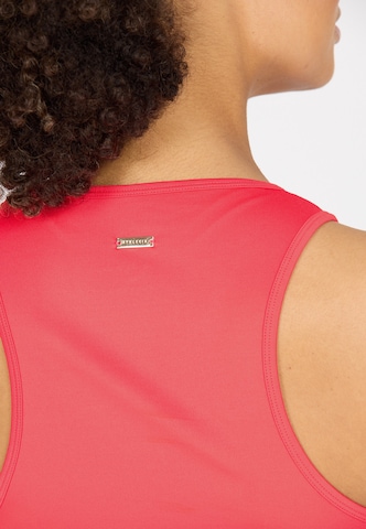 Athlecia Sports top 'Almi' in Orange