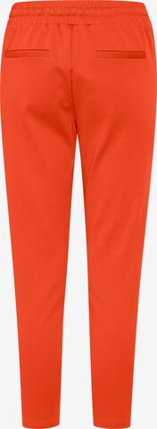ICHI Slimfit Kalhoty se sklady v pase 'KATE' – oranžová