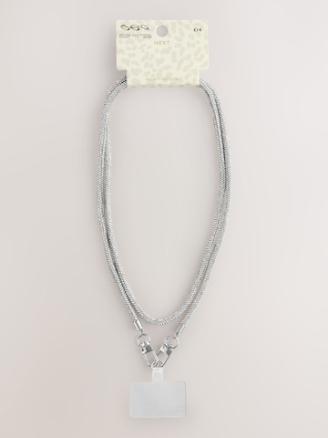 Next Handytrageriemen in Silber