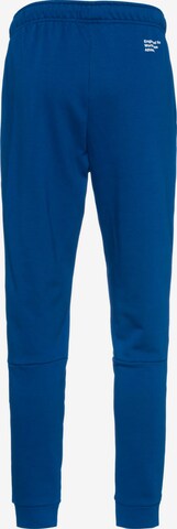 NIKE Tapered Athletic Pants in Blue