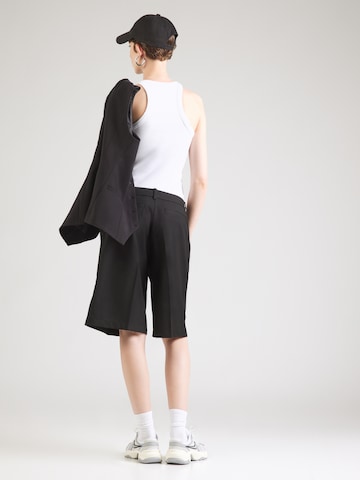 Monki Loose fit Pleat-front trousers in Black