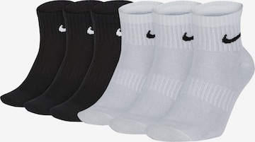 NIKE Athletic Socks in Black: front