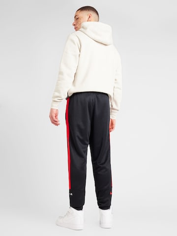 Nike Sportswear Normální Funkční kalhoty 'AIR' – černá