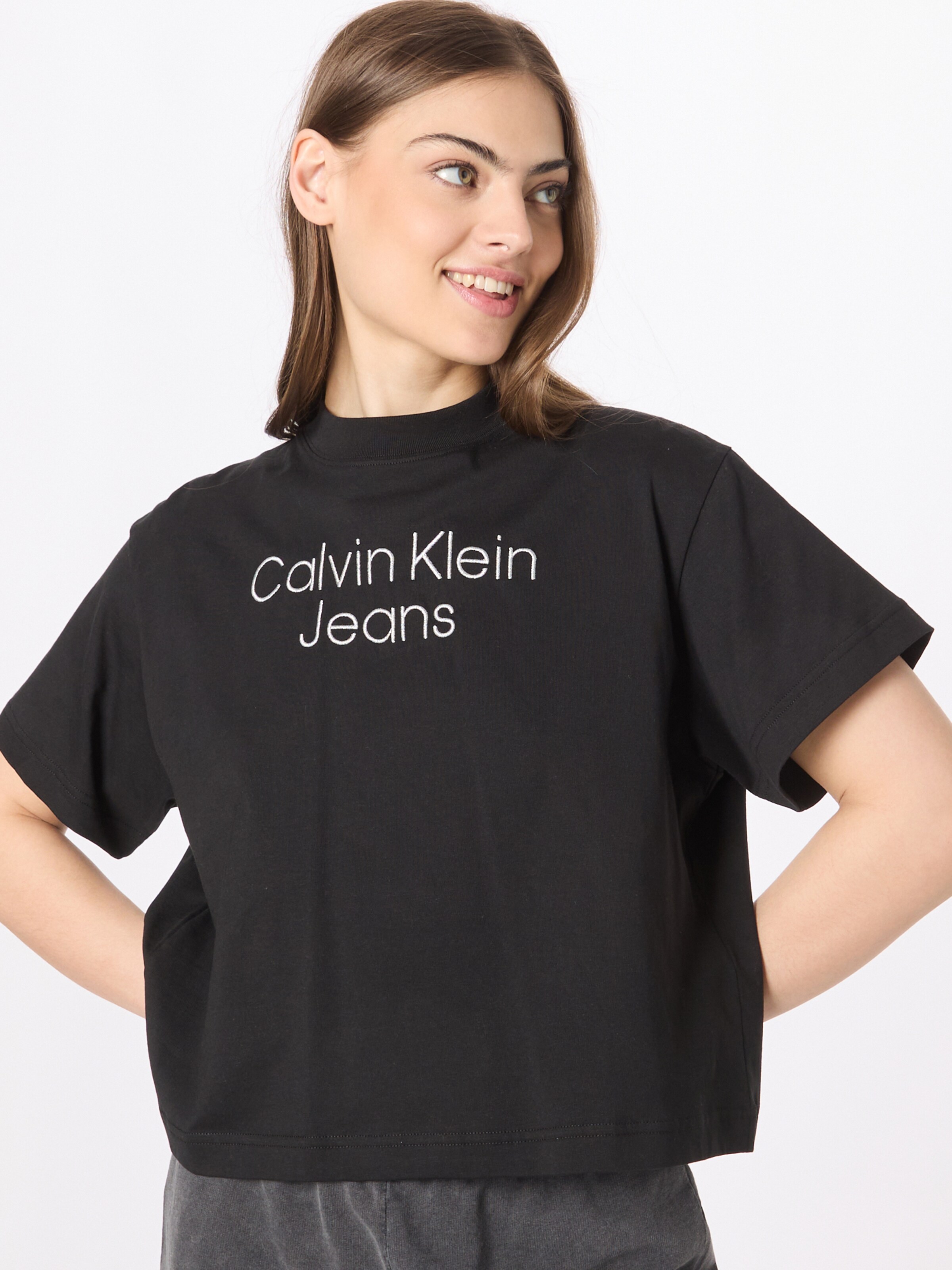 Frauen Shirts & Tops Calvin Klein T-Shirt in Schwarz - NA36213