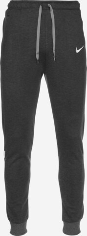 NIKE Tapered Workout Pants in Grey: front