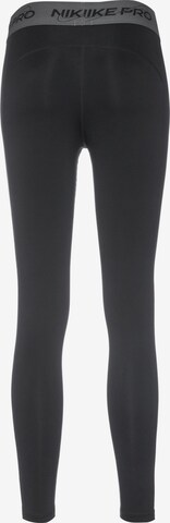 Skinny Pantaloni sport 'Pro Dri Fit' de la NIKE pe negru