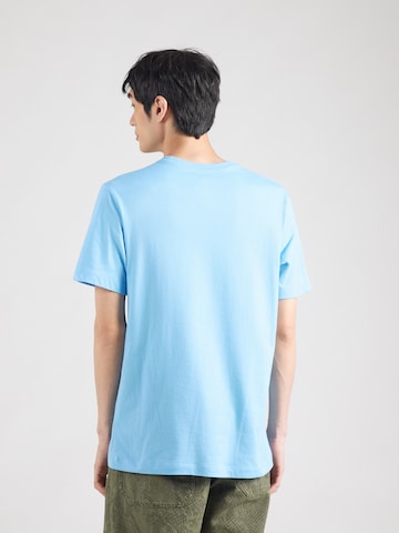 Regular fit Tricou 'Swoosh' de la Nike Sportswear pe albastru