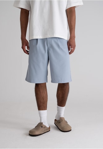 Prohibited Regular Pleat-Front Pants in Blue: front
