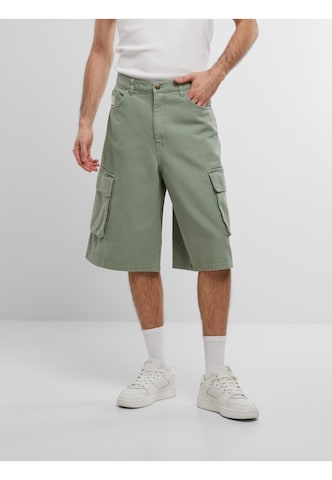 regular Pantaloni di Karl Kani in verde: frontale