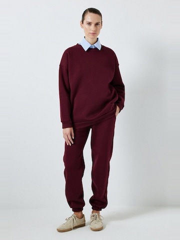 Touche Prive Joggingpak in Rood: voorkant