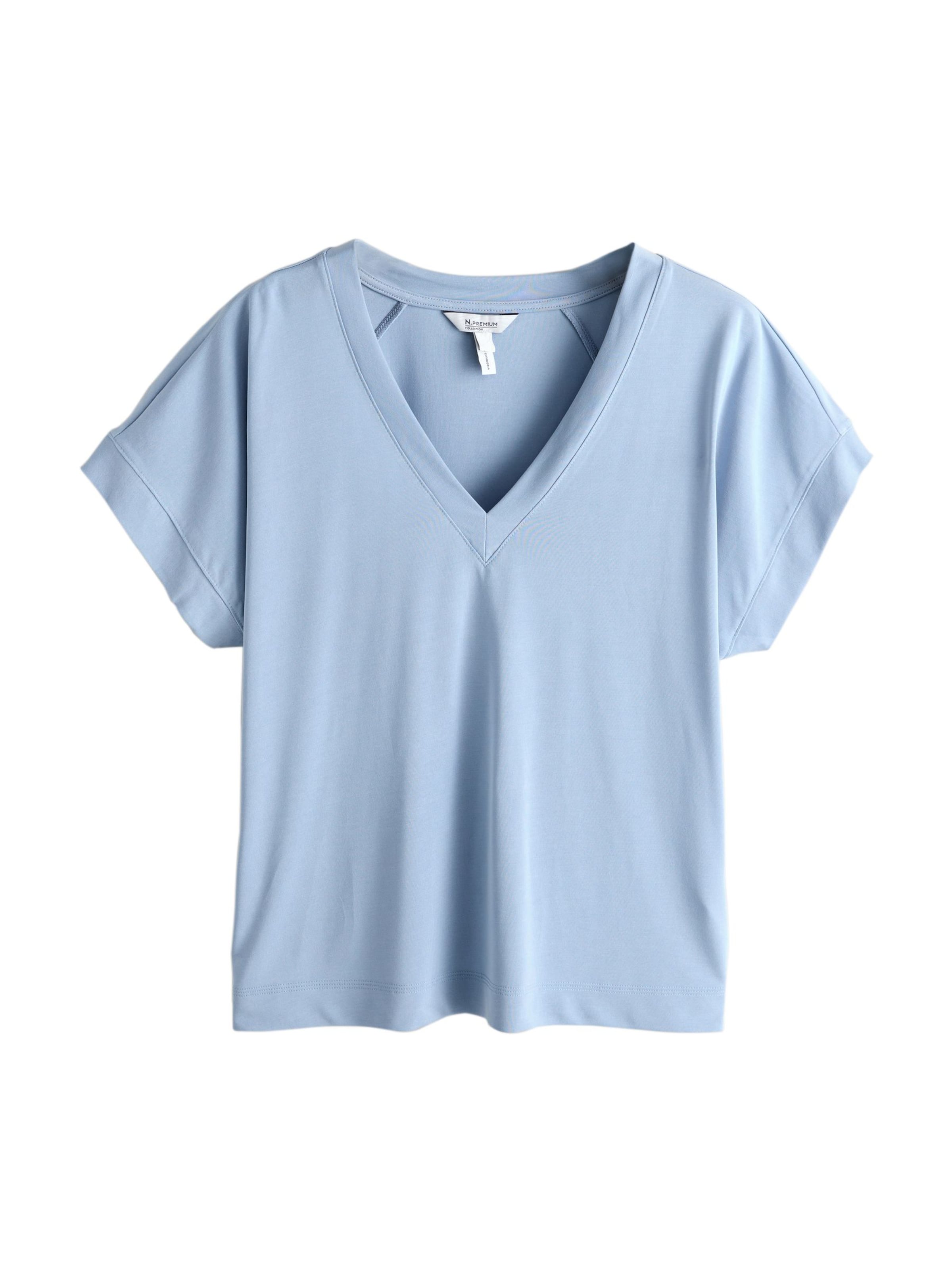 Next T-shirt i blå: framsida